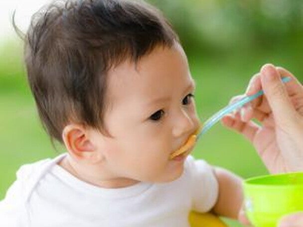 spoon feeding baby spoon feeding baby