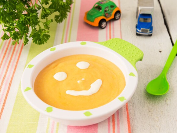 Smiley face on baby food in a bowl