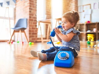 Baby girl with telephone