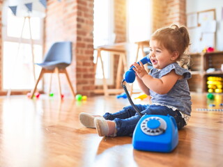 Baby girl with telephone