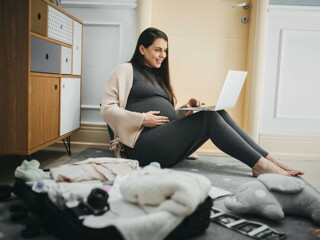 Pregnant woman with laptop