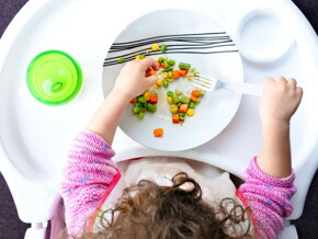 kid eating food with fork kid eating food with fork