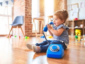 Baby girl with telephone Baby girl with telephone