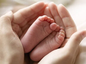 Baby feet in mother hand