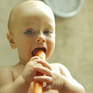 baby eating carrot