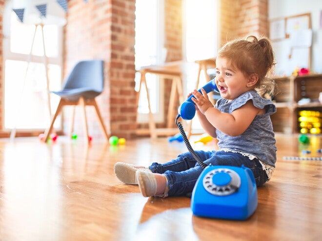 Baby girl with telephone Baby girl with telephone