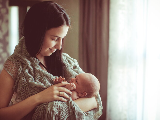 mother holding baby