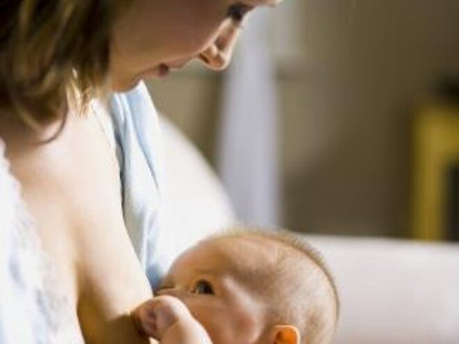 mum with baby om hands