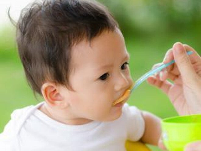 spoon feeding baby spoon feeding baby